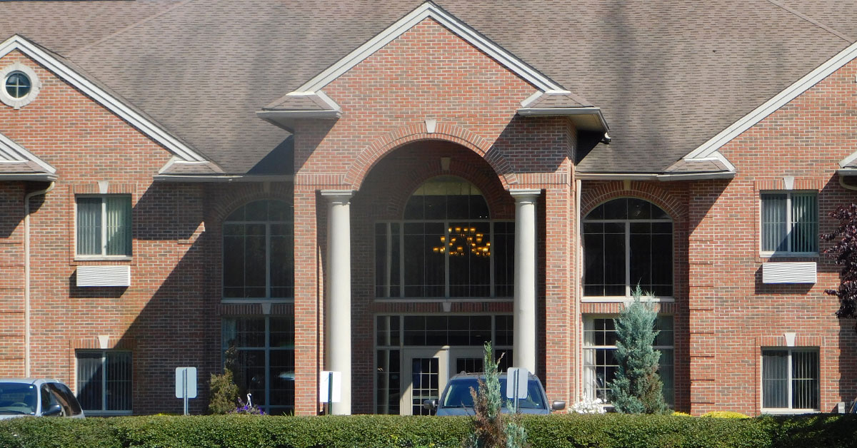 exterior entrance, large columns and doors